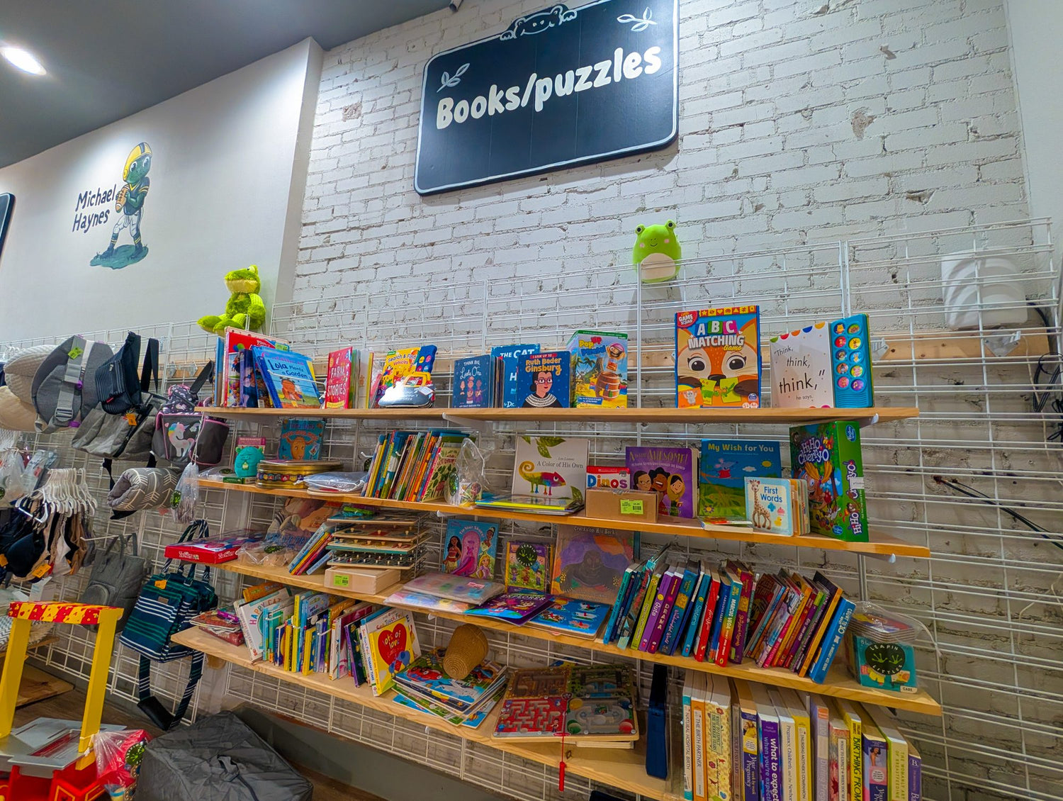 Books and puzzles shelf at Leapin' Littles